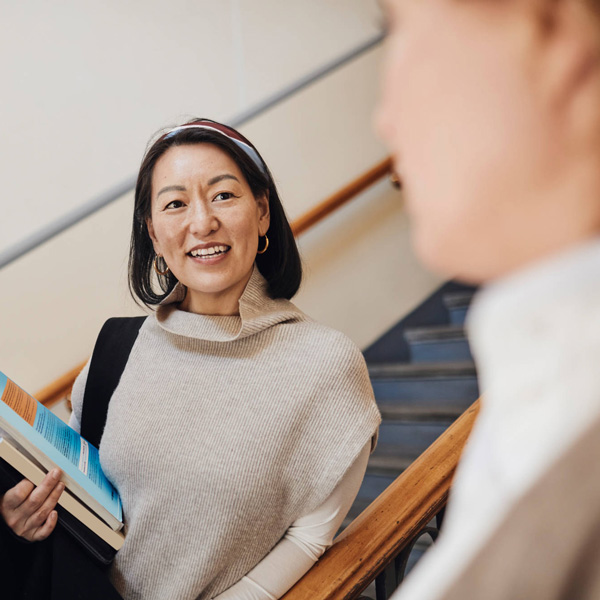 portrait of smiling young woman using mobile phone at home portrait of smiling young woman using mobile phone at home