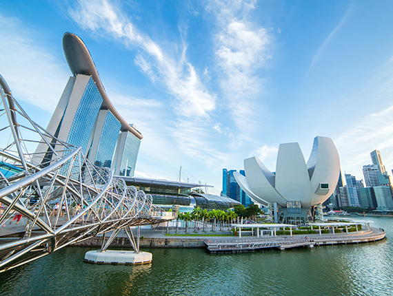 View of pedestrian Helix Bridge linking to Marina Bay Hotel and other buildings in the business district in Marina Bay, Singapore View of pedestrian Helix Bridge linking to Marina Bay Hotel and other buildings in the business district in Marina Bay, Singapore