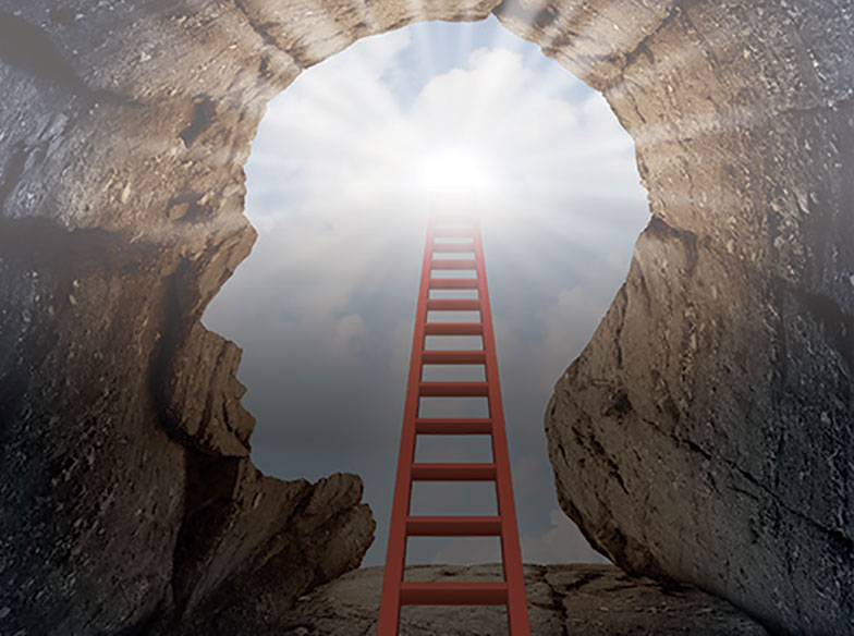 A red ladder leading out of a hole shaped like the profile of a human head with the sun shining above it